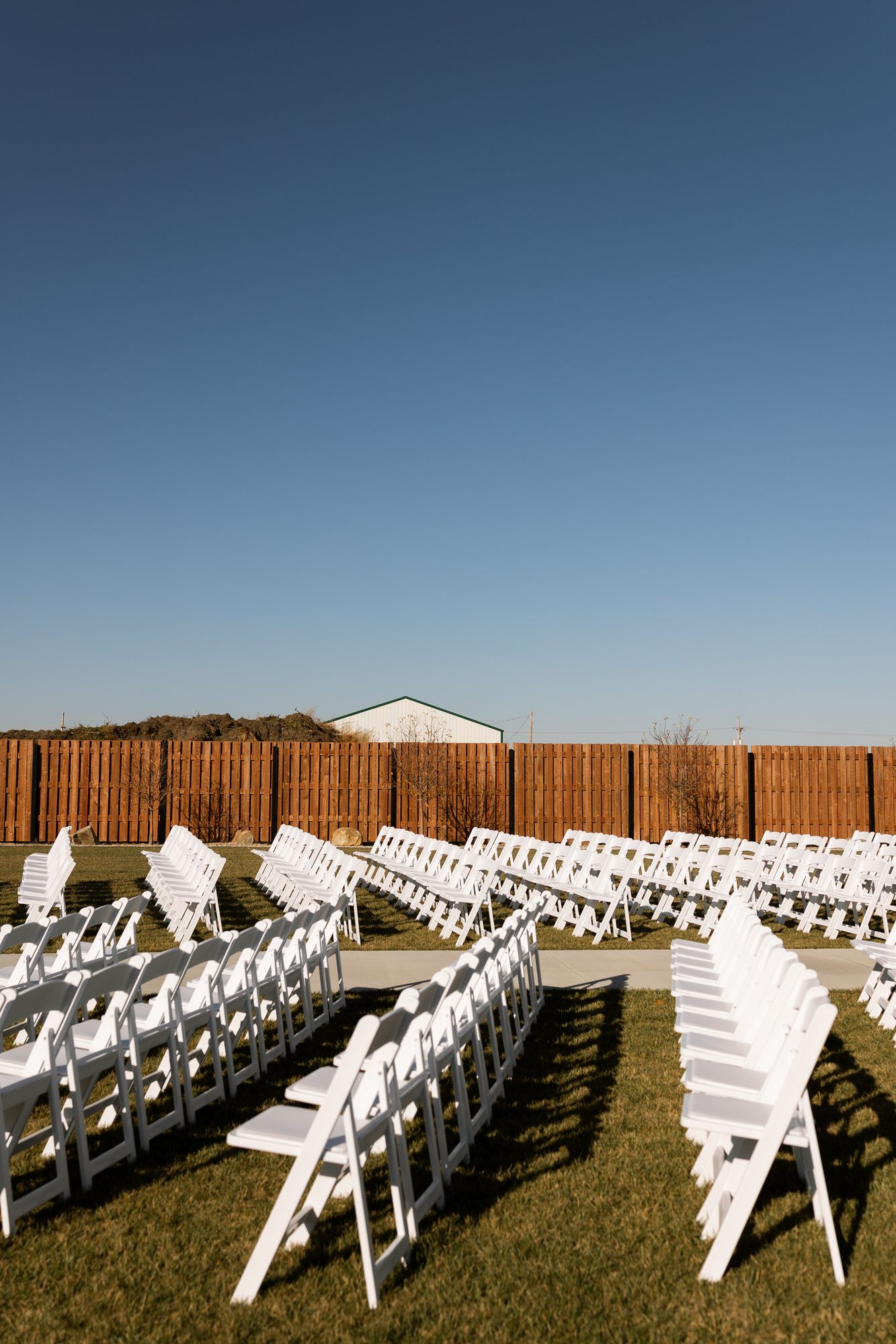 Courtyard ceremony seating under a clear Nebraska sky