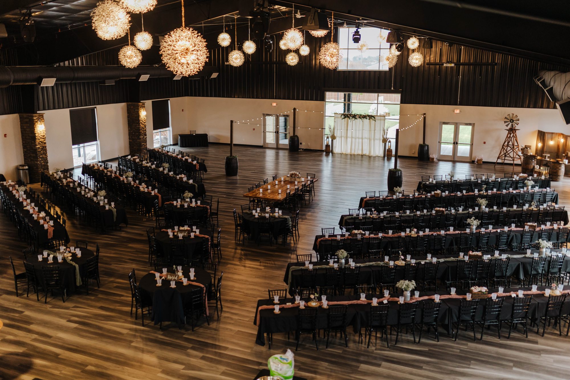 The Boulder Flatts main room glowing beneath two dozen starburst chandeliers, set for hundreds of guests